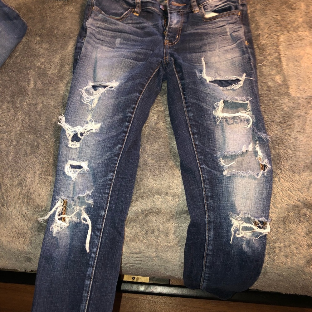Distressed AE skinny jeans
